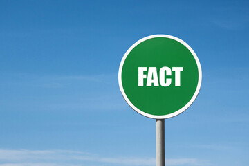 'Fact' sign in green round frame. Blue sky is on background