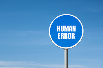 'Human error' sign in blue round frame. Blue sky is on background