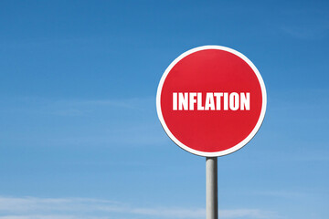 'Inflation' sign in red round frame. Clear sky is on background