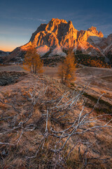 Autumn in the Italian Dolomites. The most beautiful time of the year to visit this place. Beautiful colors and breathtaking views. Mountain peaks above the valleys.