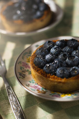 Image of cakes with blueberries and syrup. Breakfast in the morning with hard light