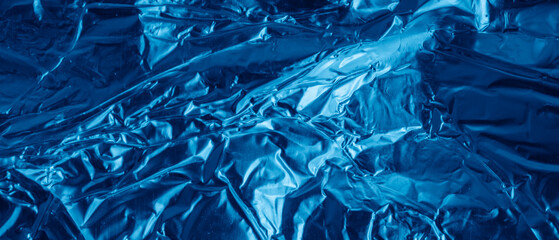 blue aluminum foil with a visible texture. background