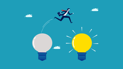 Concept change. Business readjustment. A businessman jumps to a new light bulb