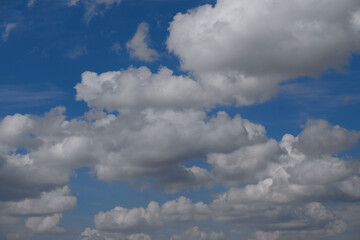 Beautiful clouds. Cloudiness in the blue sky in clear weather. Cumulus clouds on the blue sky. Cloudy on blue.