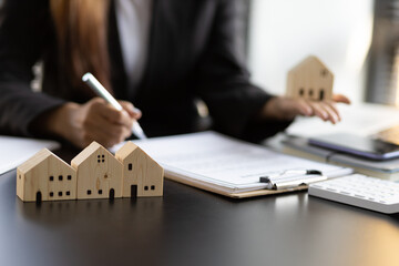 Real estate contract signing concept. Businesswoman signing a contract to legally for the purchase,...