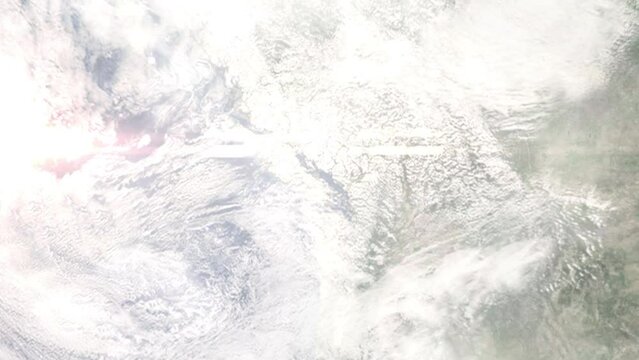 Earth zoom in from outer space to city. Zooming on Nanaimo, British Columbia, Canada. The animation continues by zoom out through clouds and atmosphere into space. Images from NASA