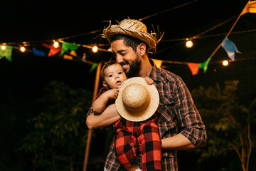 Portrait of father and baby son during the typical Brazilian Festa Junina