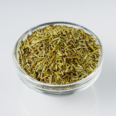 fragrant dried rosemary on a white acrylic background