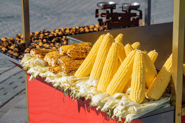 Grilled corn and roasted chestnuts on a street vendor cart