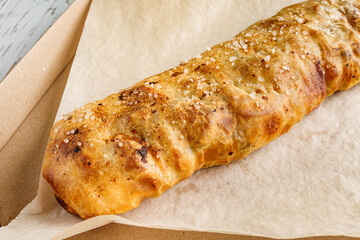 apple strudel on a white wooden rustic background