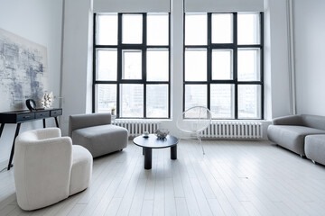 modern minimalistic interior design of light bright monochrome room with black and white furniture, clean white walls and huge windows
