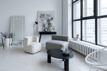 modern minimalistic interior design of light bright monochrome room with black and white furniture, clean white walls and huge windows