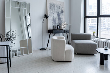 modern minimalistic interior design of light bright monochrome room with black and white furniture,...
