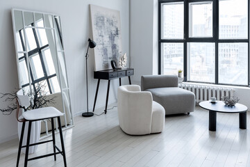 modern minimalistic interior design of light bright monochrome room with black and white furniture, clean white walls and huge windows