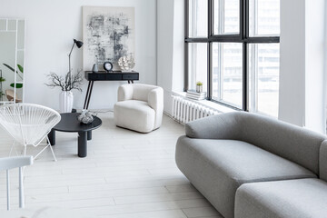 modern minimalistic interior design of light bright monochrome room with black and white furniture, clean white walls and huge windows