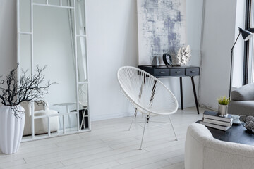 modern minimalistic interior design of light bright monochrome room with black and white furniture, clean white walls and huge windows