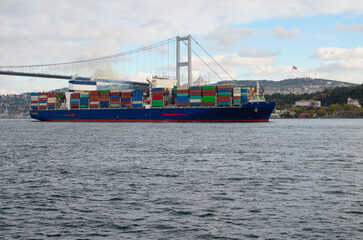 A cargo ship in the Bosphorus. Container ship with rows of containers. Concept of shipping...