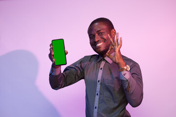 excited african man showing his phone screen