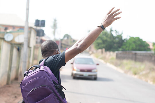 African Man Hailing For A Cab