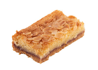 close up of a piece of  almond cake isolated on white background