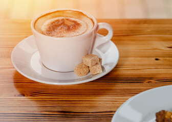 cup of coffee on wooden table in cafe