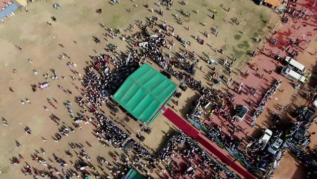 A huge crowd forms in Damaturu, Nigeria's Yobe State for a political rally for an election campaign - straight down aerial view of the crowd