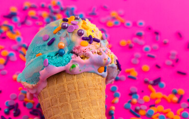 A Scoop of Unicorn Colored Ice Cream in a Cone