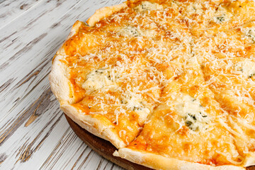 delicious hot traditional italian pizza on a white wooden rustic background