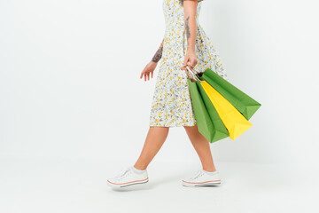 Side view young woman wearing dress and sneakers