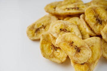 delicious dried banana on a white acrylic background