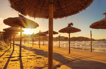 Sunset. Sandy sea beach in the evening