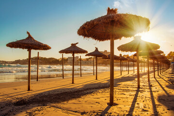 Sunset. Sandy sea beach in the evening