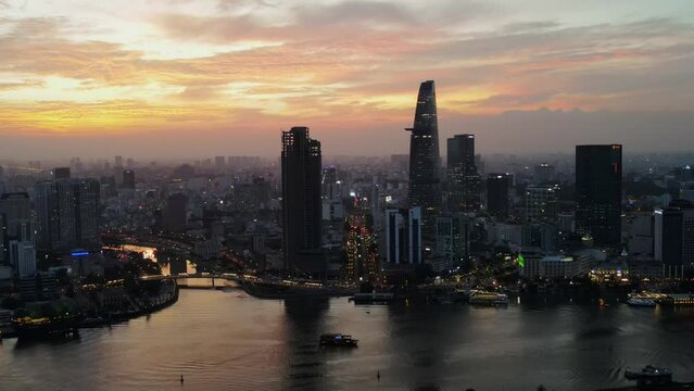 A late sunset drone shot over the skyline of Ho Chi Minh City, Vietnam