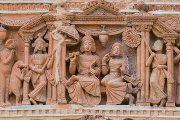 Fototapeta premium Terracotta decorations on the walls at Pratapeswar Temple at Kalna, West Bengal, India. Terracotta is a brownish-red clay that has been baked and is used for making things.