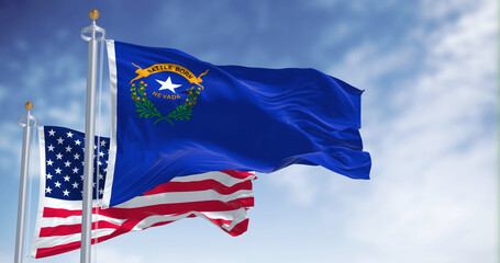 The Nevada state flag waving along with the national flag of the United States of America