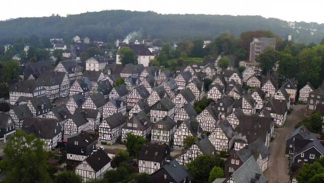 Aerial Forward Shot Of Free-Standing Residential Buildings On Hills - Freudenberg, Germany