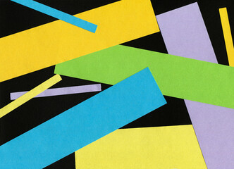 Set colorful paper scraps on black background