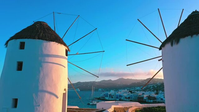 Travel to cyclades in Greece. Mykonos island windmills and greek architecture