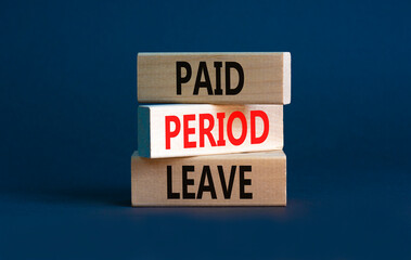 Paid period leave symbol. Concept words Paid period leave on wooden blocks. Beautiful grey table grey background. Business medical paid period leave concept. Copy space.