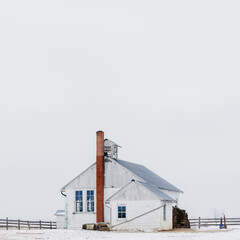 Amish Parochial School House Isolated Against a White Sky