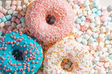 appetizing donuts with marshmallow background
