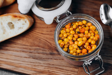 On the board pate of duck or chicken liver and sea buckthorn berries with crispy toast