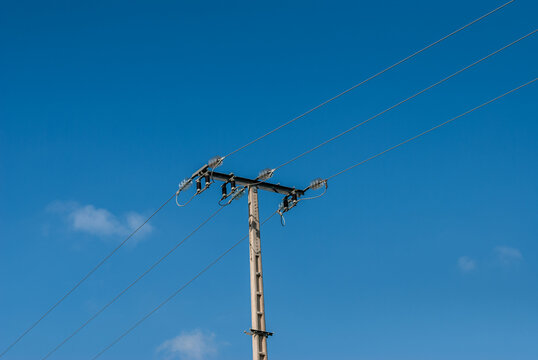 Power line pole with blue sky blue electricity concept texture and background