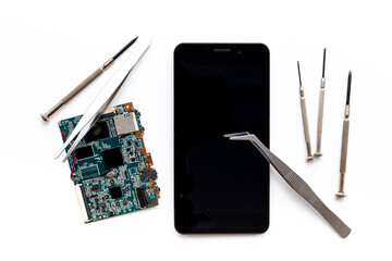 Electronics servise and repair concept - mobile phone with circuit board