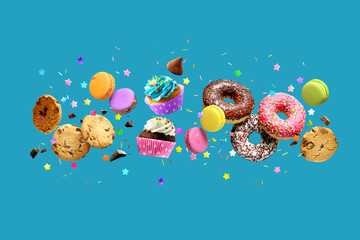 Donuts, cupcakes, cookies, macarons flying over blue background.