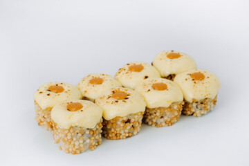 baked sushi rolls on a white background. restaurant menu.