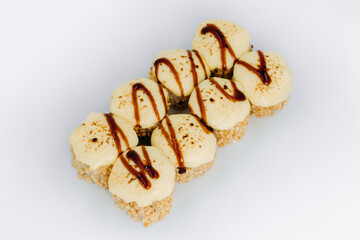 baked sushi rolls on a white background. restaurant menu.