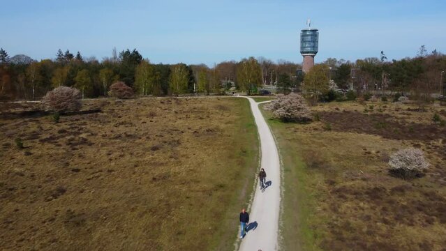 aerial images of cyclists on the cycle path to the water tower in bussum in the netherlands