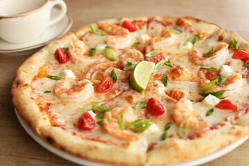 Seafood pizza on a round white plate