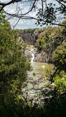 Small waterfall of the Flora river ne small Pellicone lake, Lazio, Italy